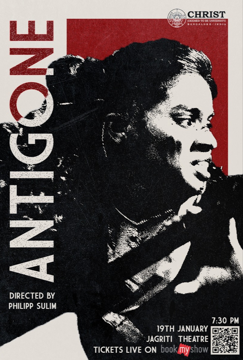 Antigone — a magenta and crimson stage composition with haze, figures in golden armour, and dramatic overhead lighting
